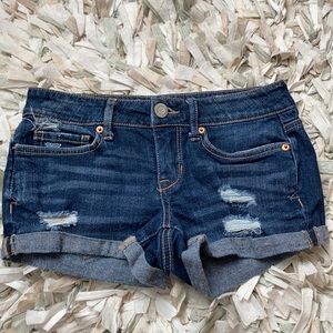 Dark wash distressed shorts